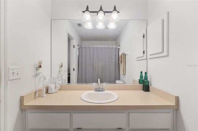 1601 NE 47th Ct, Ocala, FL 34470 - bathroom featuring vanity and a shower with shower curtain
