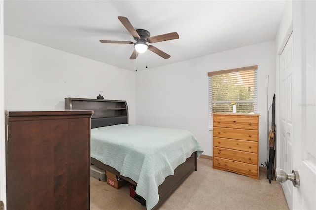 1601 NE 47th Ct, Ocala, FL 34470 - bedroom with light colored carpet, a ceiling fan, a closet, and baseboards