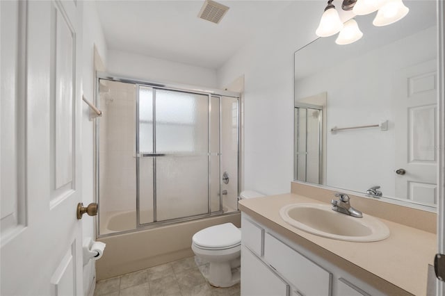 1601 NE 47th Ct, Ocala, FL 34470 - full bathroom featuring toilet, vanity, a chandelier, and enclosed tub / shower combo