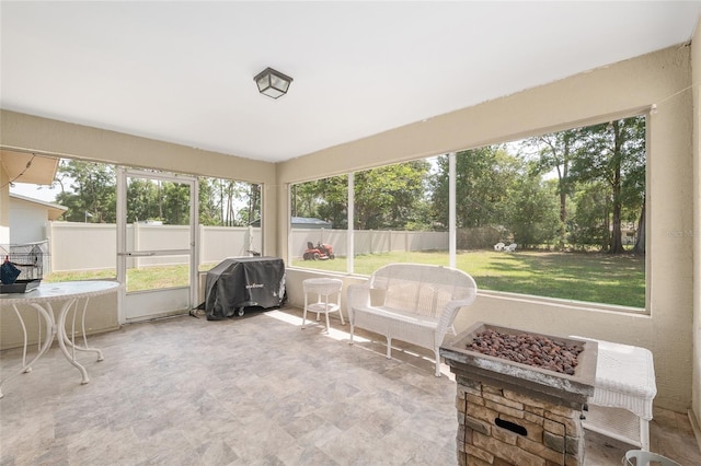 1601 NE 47th Ct, Ocala, FL 34470 - sunroom / solarium with a fire pit and healthy amount of natural light