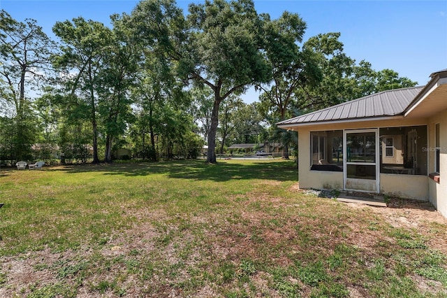 1601 NE 47th Ct, Ocala, FL 34470 - view of green lawn with a sunroom