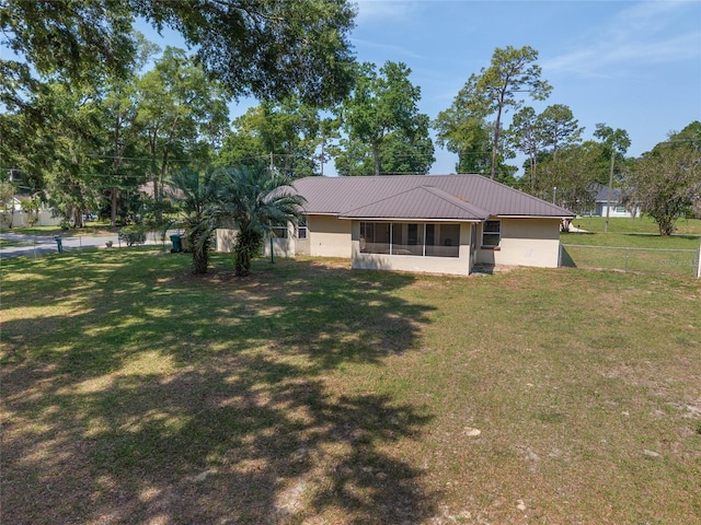 1601 NE 47th Ct, Ocala, FL 34470 - view of front of home featuring a sunroom and metal roof