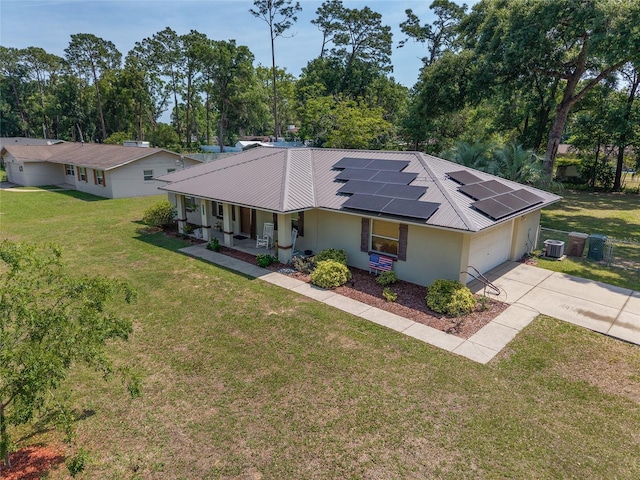 1601 NE 47th Ct, Ocala, FL 34470 - view of front of property with covered porch, driveway, stucco siding, solar panels, and central AC unit
