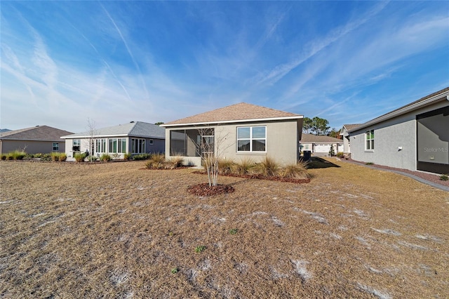 10277 SW 96th Loop, Ocala, FL 34481 - back of house with a sunroom