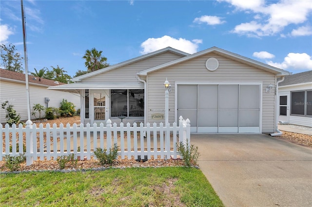2608 Botello Ave, The Villages, FL 32162 - ranch-style home featuring concrete driveway, a fenced front yard, and a garage