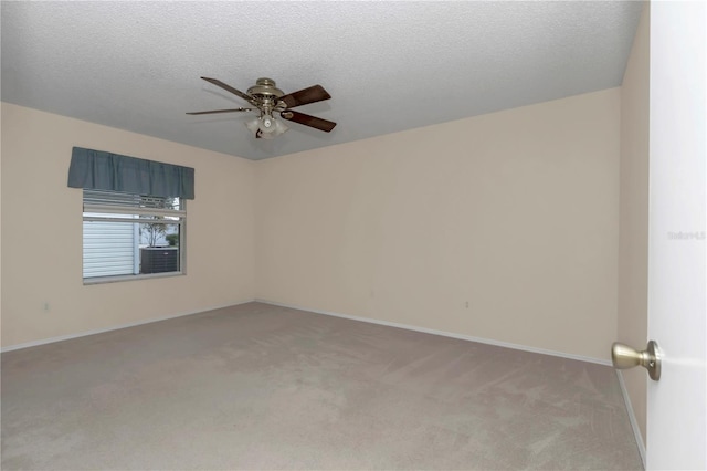 2608 Botello Ave, The Villages, FL 32162 - unfurnished room with light colored carpet, ceiling fan, baseboards, and a textured ceiling