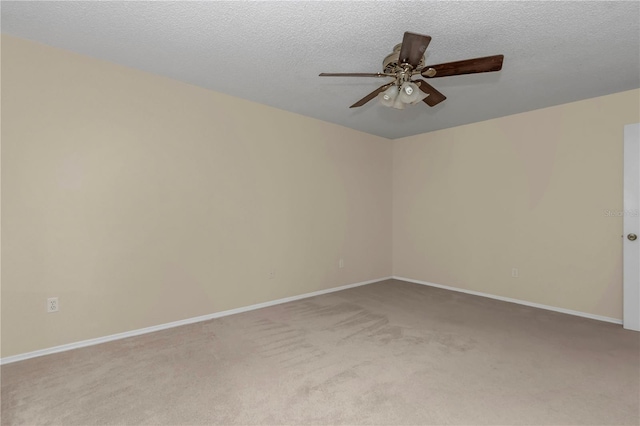 2608 Botello Ave, The Villages, FL 32162 - unfurnished room with ceiling fan, light carpet, baseboards, and a textured ceiling