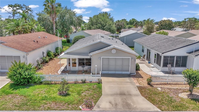2608 Botello Ave, The Villages, FL 32162 - view of front facade with concrete driveway and a garage