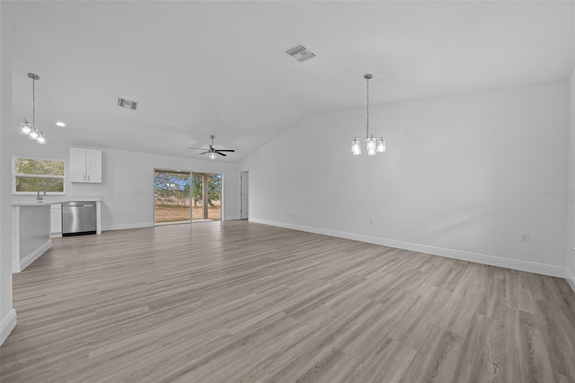 7 Walnut Pl, Ocala, FL 34480 - unfurnished living room featuring a chandelier, vaulted ceiling, baseboards, light wood-style flooring, and a ceiling fan