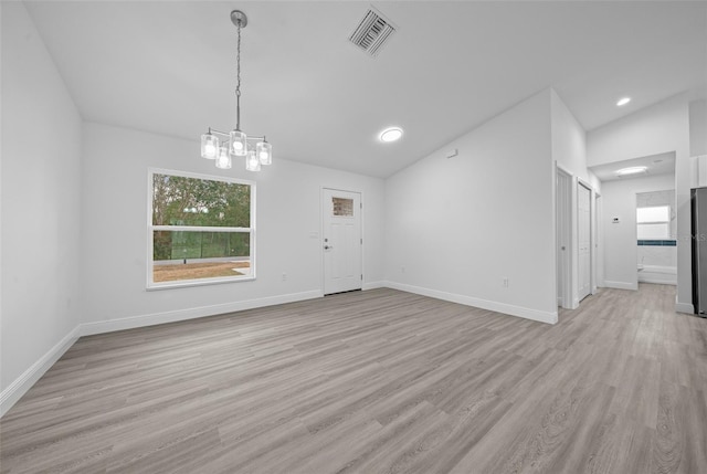 7 Walnut Pl, Ocala, FL 34480 - unfurnished dining area featuring light wood finished floors, lofted ceiling, a chandelier, baseboards, and recessed lighting