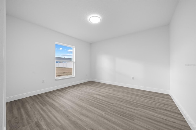 7 Walnut Pl, Ocala, FL 34480 - empty room with wood finished floors and baseboards