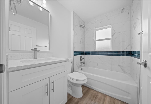 7 Walnut Pl, Ocala, FL 34480 - full bathroom featuring toilet, shower / washtub combination, vanity, and wood finished floors