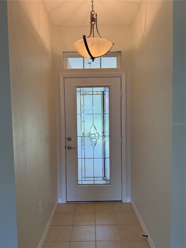 206 SE 8th Ave, Williston, FL 32696 - entryway featuring light tile patterned flooring and baseboards