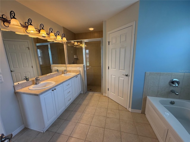 206 SE 8th Ave, Williston, FL 32696 - full bathroom featuring tile patterned floors, double vanity, a bath, and a stall shower