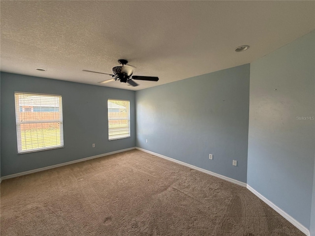 206 SE 8th Ave, Williston, FL 32696 - carpeted spare room featuring a ceiling fan, plenty of natural light, and a textured ceiling