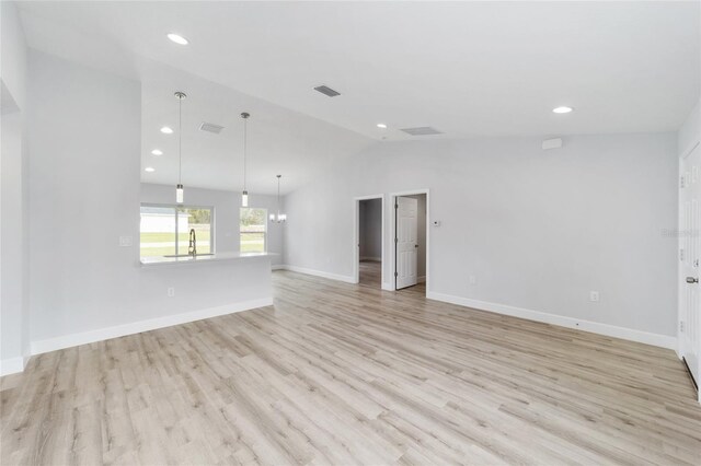 4386 SW 158th Ct, Ocala, FL 34481 - spare room with lofted ceiling, light wood-style flooring, a sink, recessed lighting, and baseboards