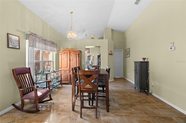10468 S Drew Bryant Cir, Floral City, FL 34436 - dining space with baseboards, a chandelier, and high vaulted ceiling