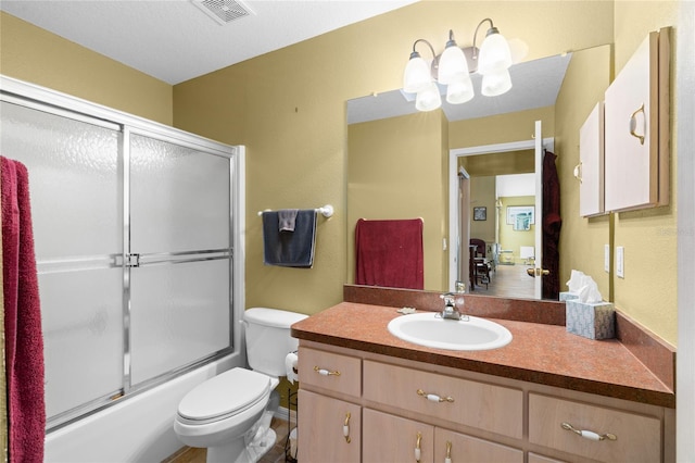10468 S Drew Bryant Cir, Floral City, FL 34436 - bathroom featuring toilet, vanity, and shower / bath combination with glass door
