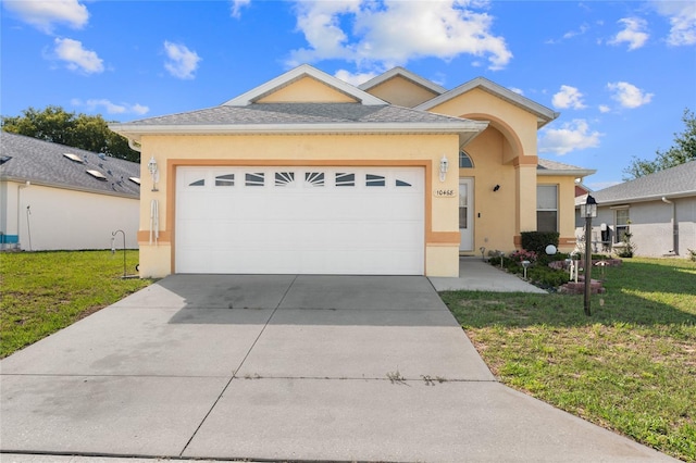10468 S Drew Bryant Cir, Floral City, FL 34436 - ranch-style home with stucco siding, a front yard, concrete driveway, and an attached garage