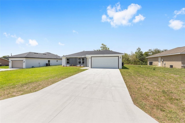 16697 SW 30 Avenue Rd, Ocala, FL 34473 - ranch-style home with a front yard, concrete driveway, central air condition unit, and an attached garage