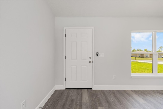 16697 SW 30 Avenue Rd, Ocala, FL 34473 - unfurnished room with dark wood finished floors, baseboards, and healthy amount of natural light