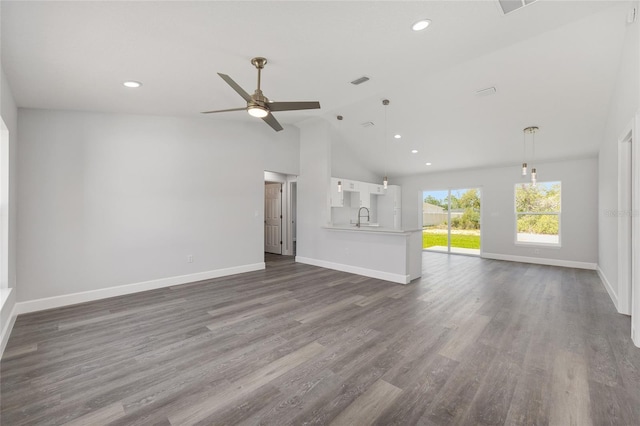 16697 SW 30 Avenue Rd, Ocala, FL 34473 - unfurnished living room featuring a sink, a ceiling fan, baseboards, recessed lighting, and dark wood-style floors