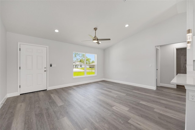 16697 SW 30 Avenue Rd, Ocala, FL 34473 - unfurnished living room featuring a ceiling fan, wood finished floors, baseboards, recessed lighting, and lofted ceiling
