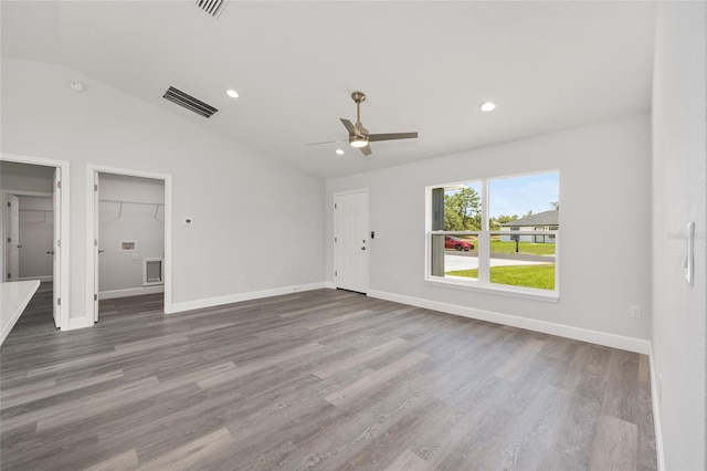 16697 SW 30 Avenue Rd, Ocala, FL 34473 - unfurnished living room with lofted ceiling, a ceiling fan, wood finished floors, baseboards, and recessed lighting