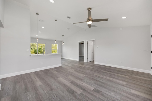 16697 SW 30 Avenue Rd, Ocala, FL 34473 - empty room with ceiling fan, lofted ceiling, recessed lighting, baseboards, and wood finished floors