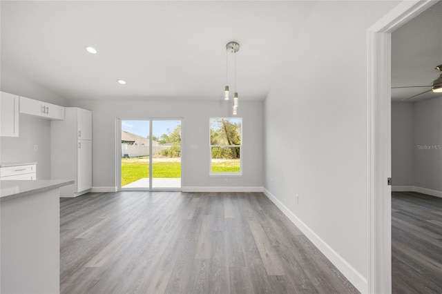 16697 SW 30 Avenue Rd, Ocala, FL 34473 - unfurnished living room with wood finished floors, baseboards, recessed lighting, and a ceiling fan