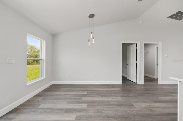 16697 SW 30 Avenue Rd, Ocala, FL 34473 - empty room featuring vaulted ceiling, baseboards, and wood finished floors