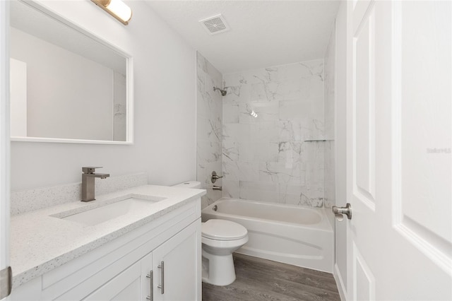 16697 SW 30 Avenue Rd, Ocala, FL 34473 - bathroom with toilet, vanity, wood finished floors, and tub / shower combination