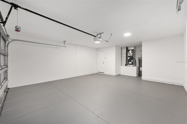 16697 SW 30 Avenue Rd, Ocala, FL 34473 - garage with heating unit, recessed lighting, a garage door opener, and baseboards