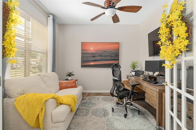 12804 SE 90th Court Rd, Summerfield, FL 34491 - home office featuring wood finished floors, a ceiling fan, and baseboards