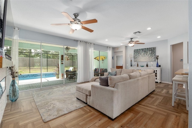 12804 SE 90th Court Rd, Summerfield, FL 34491 - living area featuring a ceiling fan, recessed lighting, and a textured ceiling