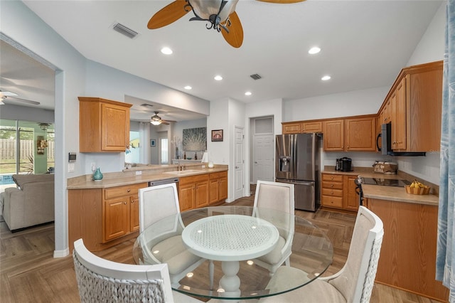 12804 SE 90th Court Rd, Summerfield, FL 34491 - kitchen with a ceiling fan, appliances with stainless steel finishes, light countertops, recessed lighting, and a sink