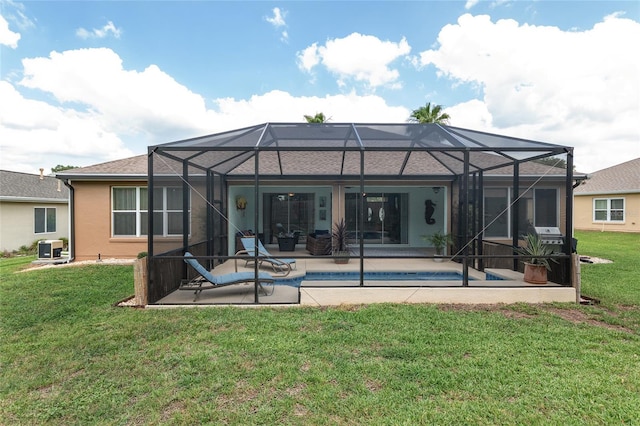 12804 SE 90th Court Rd, Summerfield, FL 34491 - rear view of property featuring a patio area, a lawn, stucco siding, an outdoor pool, and glass enclosure