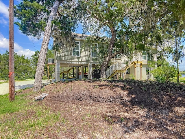1575 S Wallace Pt Unit 23, Crystal River, FL 34429 - view of front of house featuring stairway, a carport, and driveway