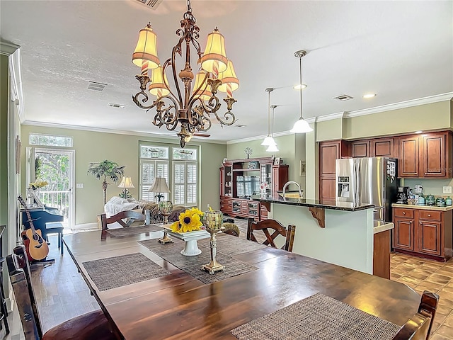 1575 S Wallace Pt Unit 23, Crystal River, FL 34429 - dining space with a chandelier, crown molding, and recessed lighting