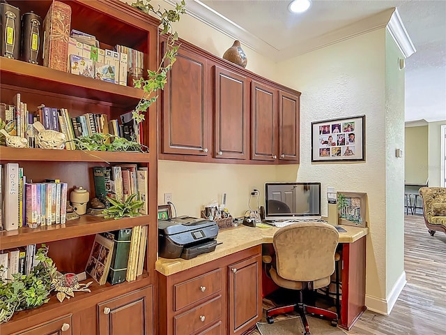 1575 S Wallace Pt Unit 23, Crystal River, FL 34429 - office space featuring built in desk, light wood finished floors, crown molding, and baseboards