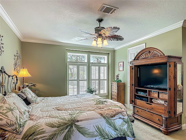 1575 S Wallace Pt Unit 23, Crystal River, FL 34429 - bedroom with light carpet, crown molding, a textured ceiling, and ceiling fan