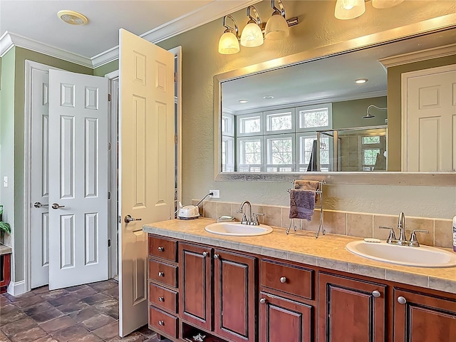 1575 S Wallace Pt Unit 23, Crystal River, FL 34429 - full bathroom featuring crown molding, a textured wall, double vanity, plenty of natural light, and a shower with door