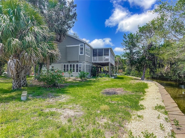 1575 S Wallace Pt Unit 23, Crystal River, FL 34429 - view of grassy yard with a sunroom