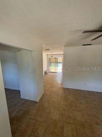 3740 NE 5th St, Ocala, FL 34470 - spare room featuring a textured ceiling