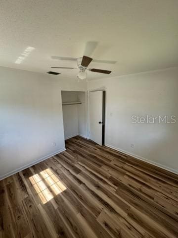 3740 NE 5th St, Ocala, FL 34470 - unfurnished bedroom featuring wood finished floors, baseboards, a closet, and ceiling fan
