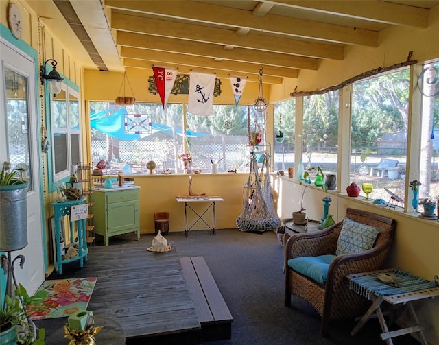 22736 SW 117th St, Dunnellon, FL 34431 - sunroom / solarium featuring plenty of natural light, beamed ceiling, and carpet