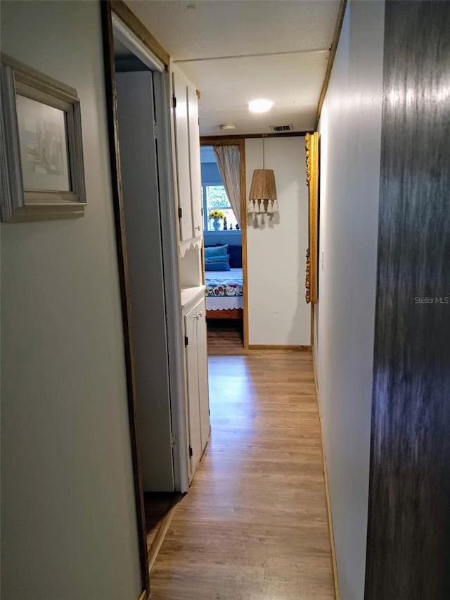22736 SW 117th St, Dunnellon, FL 34431 - hallway featuring light wood-style flooring and baseboards