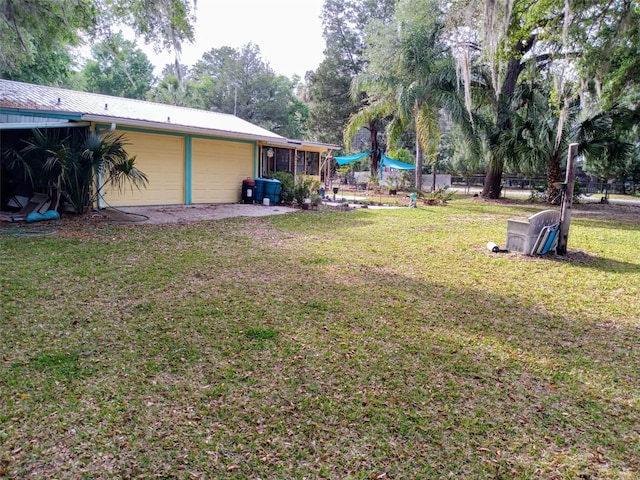 22736 SW 117th St, Dunnellon, FL 34431 - view of grassy yard with a garage