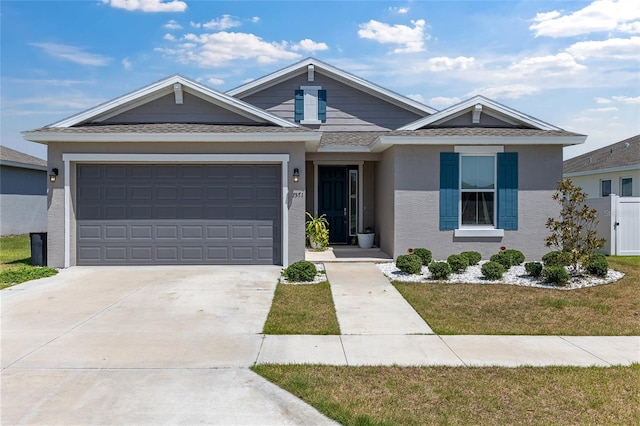 7571 SW 64th Street Rd, Ocala, FL 34474 - view of front of home featuring driveway, an attached garage, and stucco siding