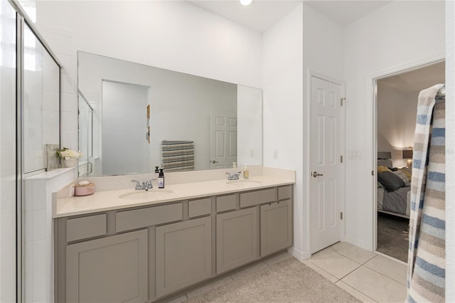 7571 SW 64th Street Rd, Ocala, FL 34474 - bathroom featuring ensuite bathroom, double vanity, tile patterned flooring, and tiled shower